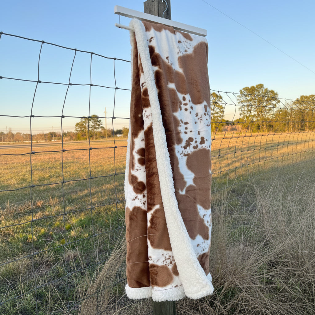 Onze deken met koemotief 100x150cm