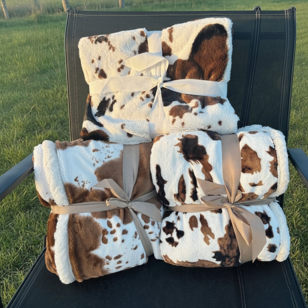 Onze deken met koemotief 100x150cm